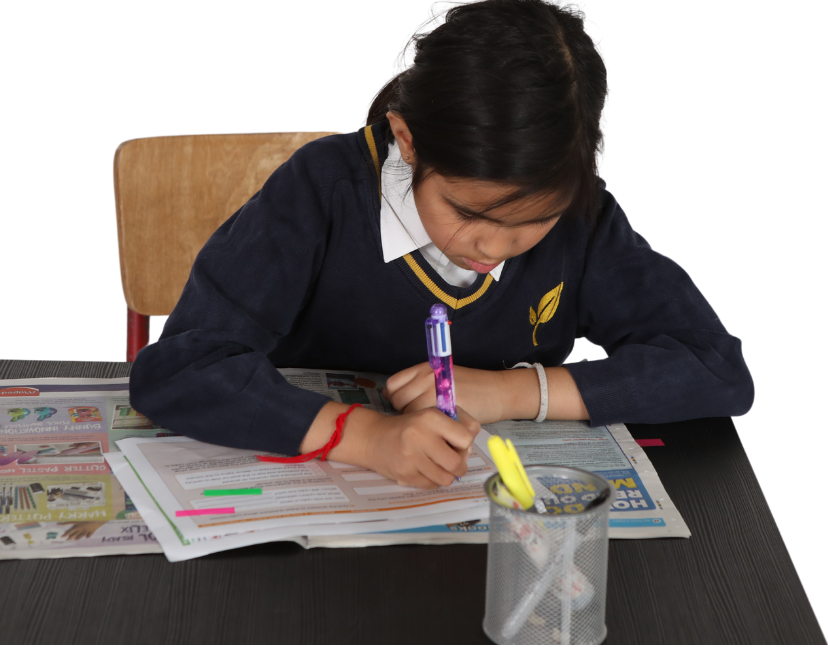 A pupil using First News Printables in the classroom