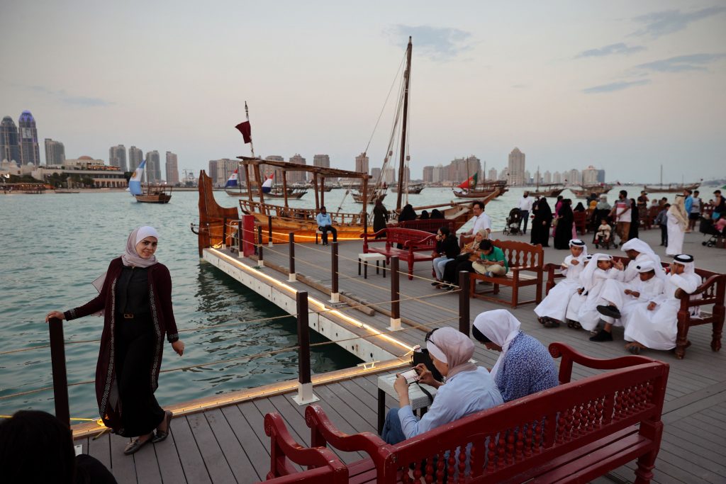 A woman posing for a photo at Katara Beach in Doha during the FIFA World Cup Qatar 2022.