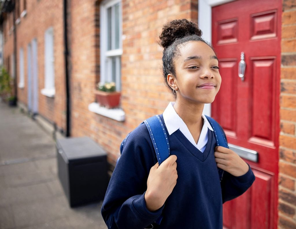 Portrait of a happy teenage girl going to school - lifestyle concepts