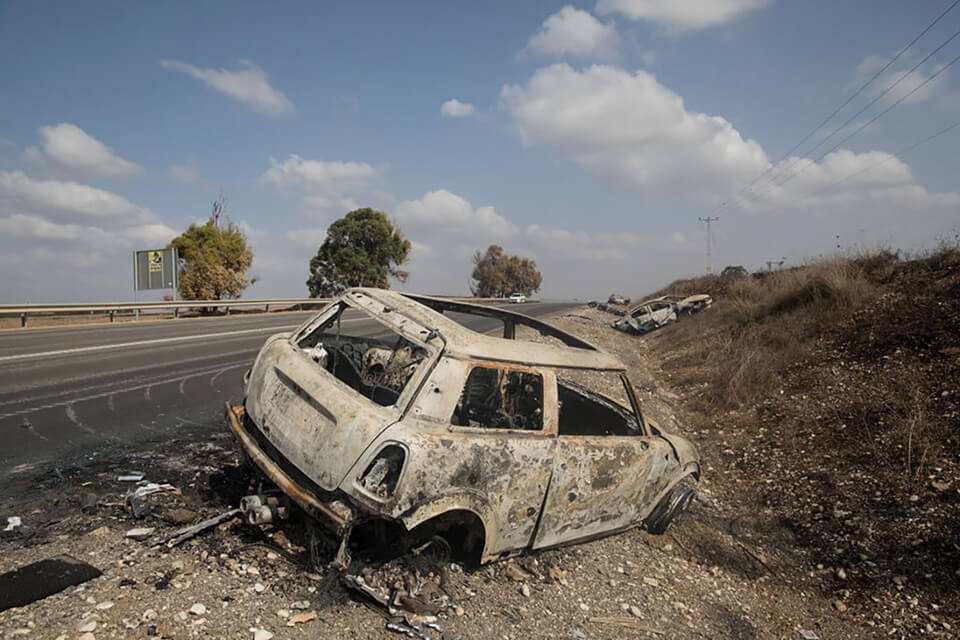 A destroyed car that was attacked by Palestinian fighters in Israel