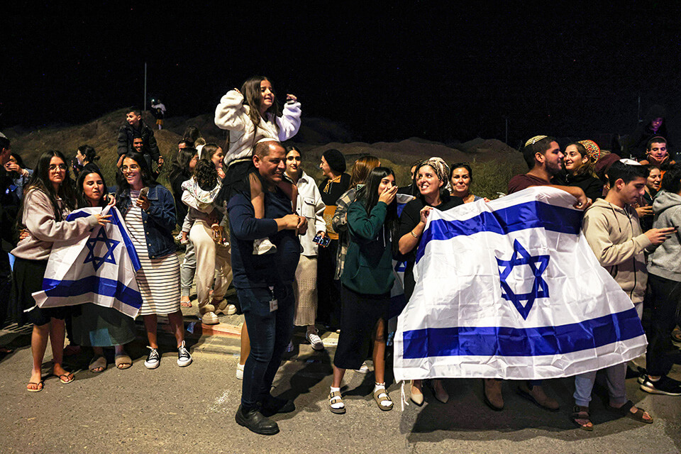 People celebrate as hostages are released by Hamas