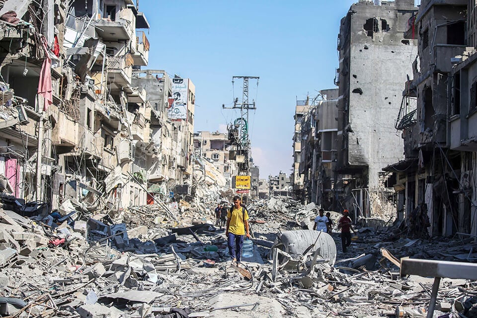 KHAN YUNIS, GAZA - APRIL 7: People inspect damage and remove items from their homes following Israeli airstrikes on April 07, 2024 in Khan Yunis, Gaza.