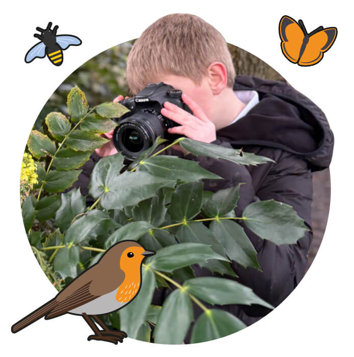 Boy taking a photograph