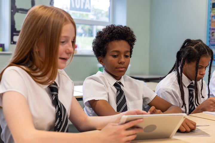 Kids on tablets in classroom 3 Kids on tablets in classroom 3