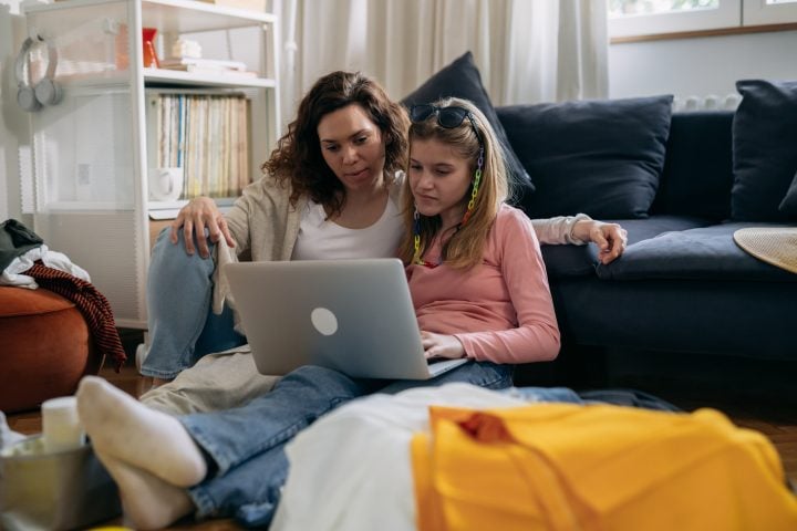 mother and daughter at home Parent and child on laptop