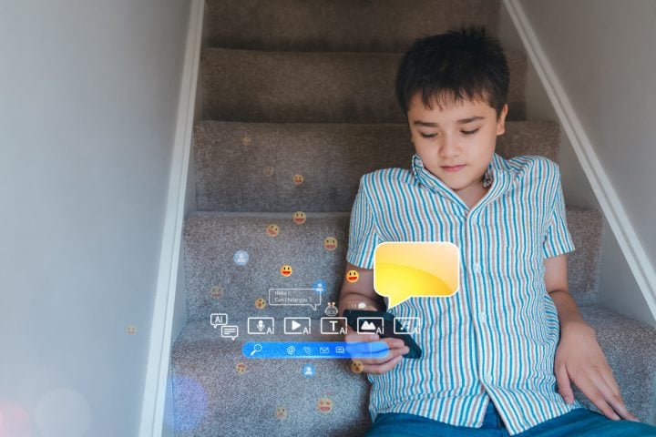 Teenager using smartphone chatting with friends and learning music from AI chatbot.Concept for online education,digital lifestyle, social media, virtual interaction,e-learningonline behaviour concepts